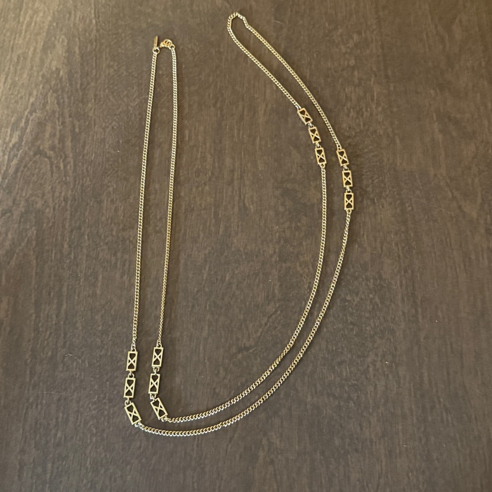 monet long gold tone art deco necklace Roughly 54"